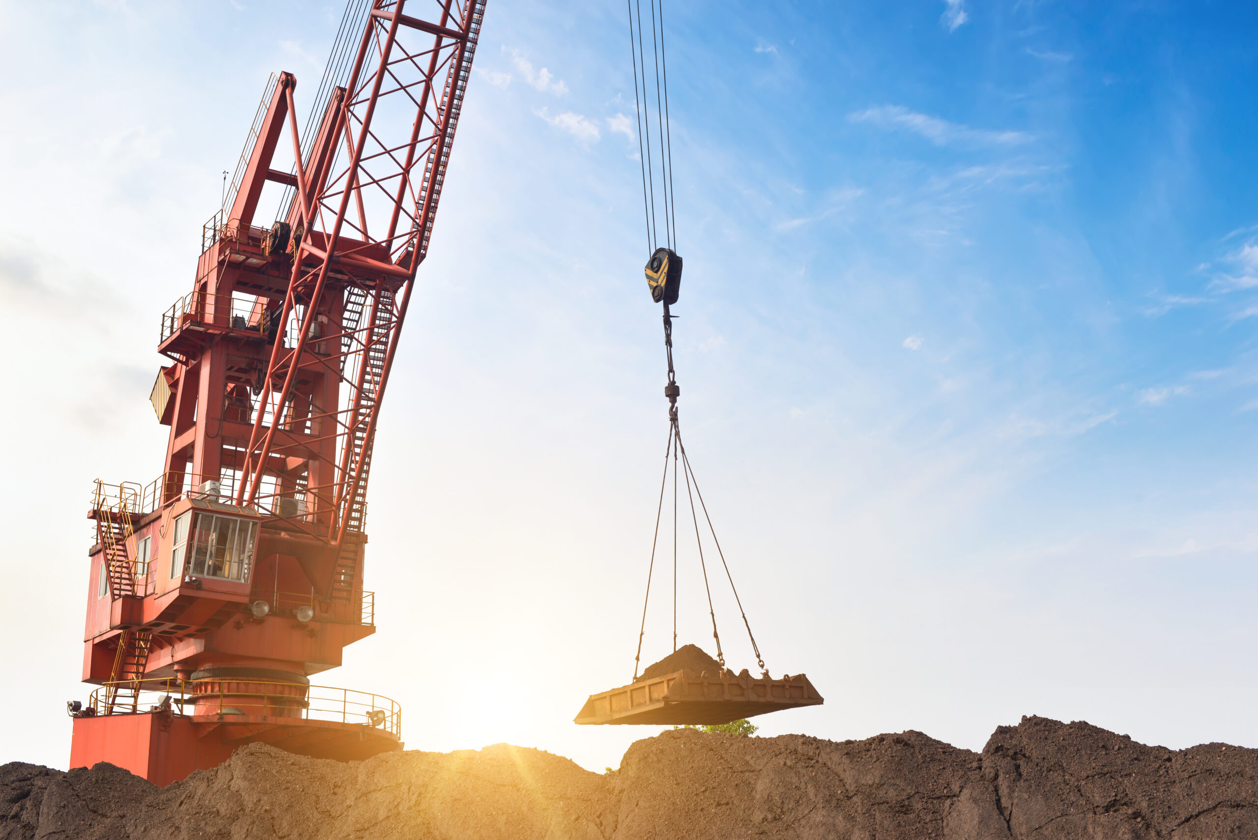 crane is carrying dirt scaled